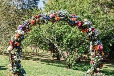 wedding arch, diy wedding arches, wedding arch flowers, wedding arch ideas, circular wedding arch, colorful wedding arch, wedding archway with silk flowers