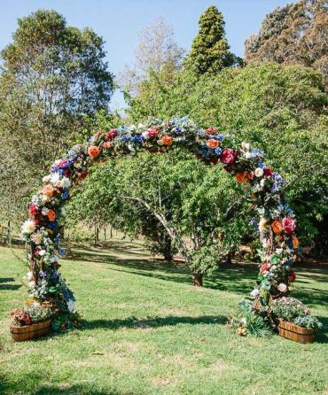 wedding arch, diy wedding arches, wedding arch flowers, wedding arch ideas, circular wedding arch, colorful wedding arch, wedding archway with silk flowers