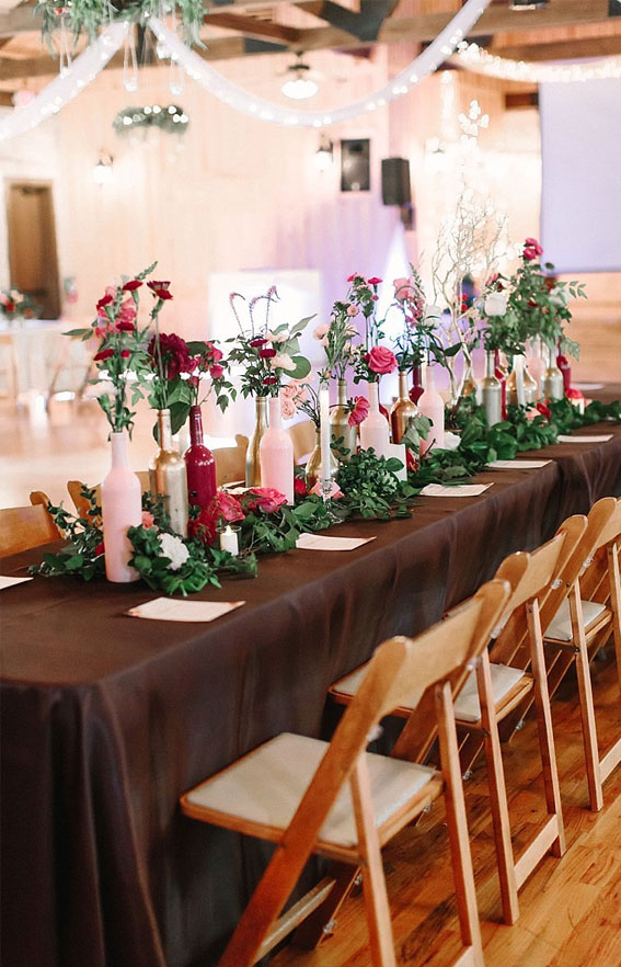 pink and green wedding centerpieces, rustic wedding table, bottle filled in flower wedding centerpieces