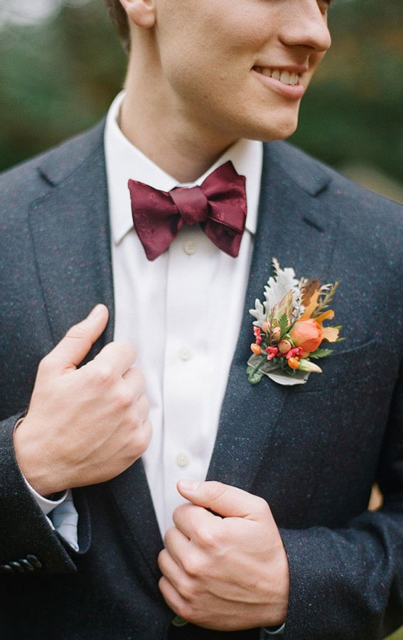 groom navy suit, burgundy bow tie, burgundy and navy wedding