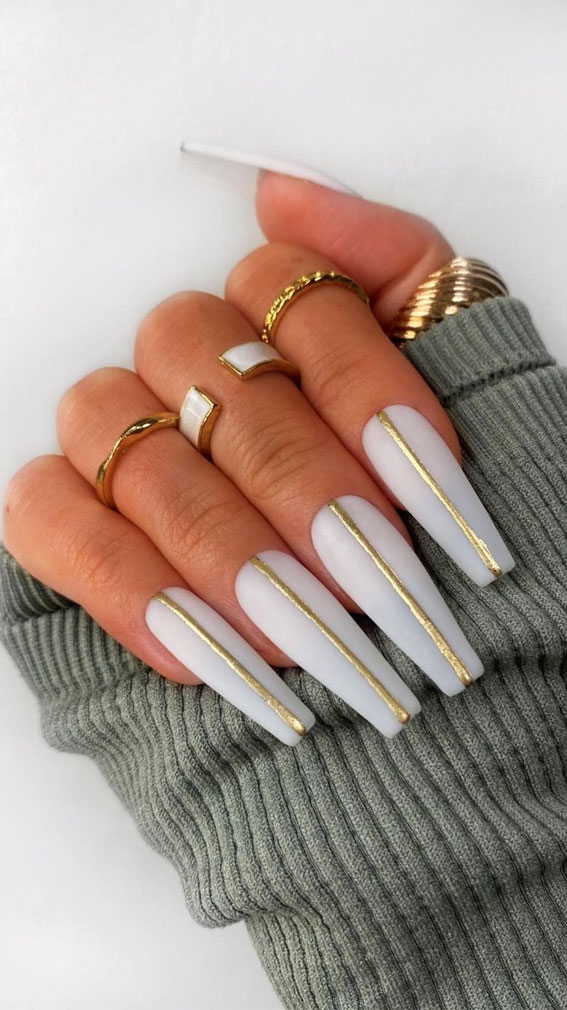 long coffin white nails with gold line, white nail polish, white nail art, white nails, white nail designs, white nail designs 2021, white nail designs coffin, white nail designs acrylic, white nail art, white nail ideas, white acrylic nails, simple white nail designs