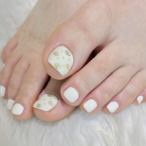 50 Best Wedding Toe Nails : Gold Gucci Logo on White Colour Toe Nails