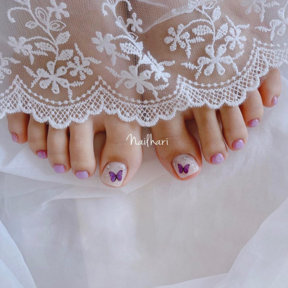 50 Trendy Pedicure Designs To Dress Up Your Toe Nails : Subtle Toe Nails with Purple Butterflies