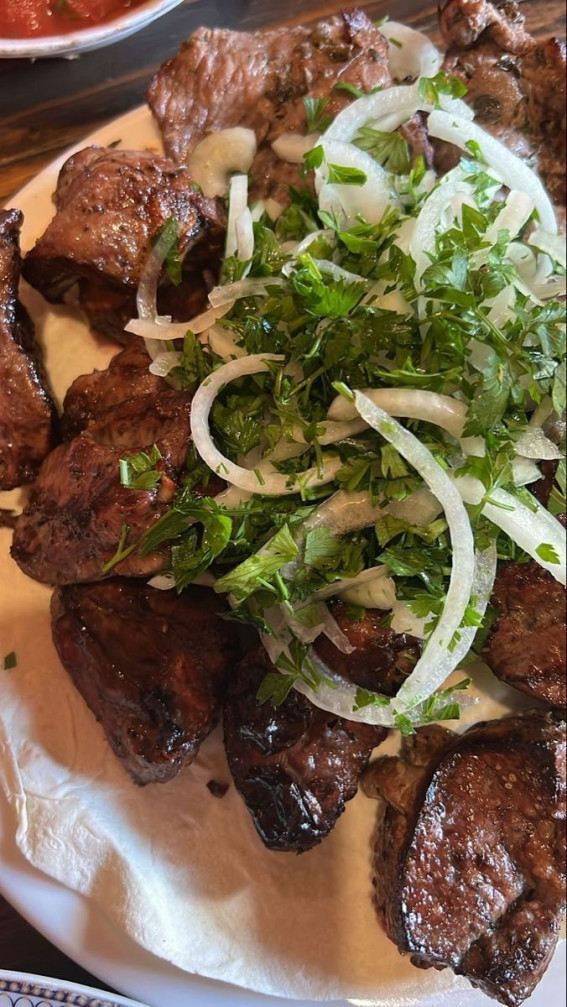 Irresistible Food Cravings Unveiled : Steak Topped with Onion Salad