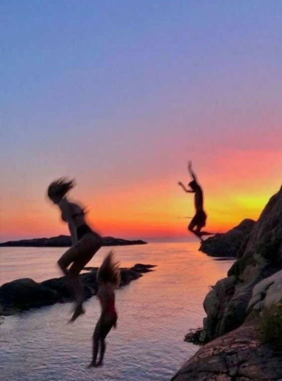 Sun-Kissed Summers Embracing the Aesthetics of a Radiant Season : Jumping into the sea during sunset